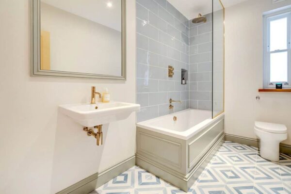 boilingbroke-loft-conversion-bathroom completed loft conversion bathroom light blue tiles