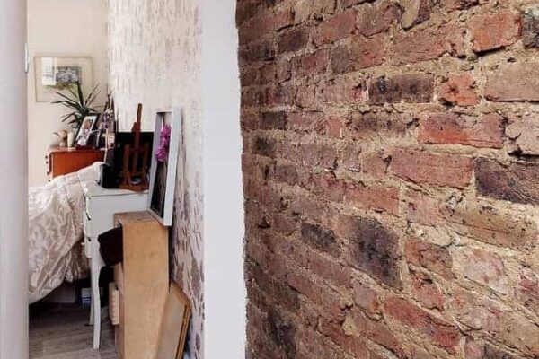 coursehill-road-loft-conversion-visible-party-wall completed loft conversion with visible brick