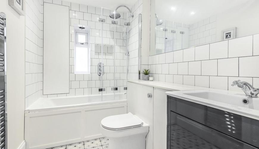 loft conversion bathroom white and black tiling