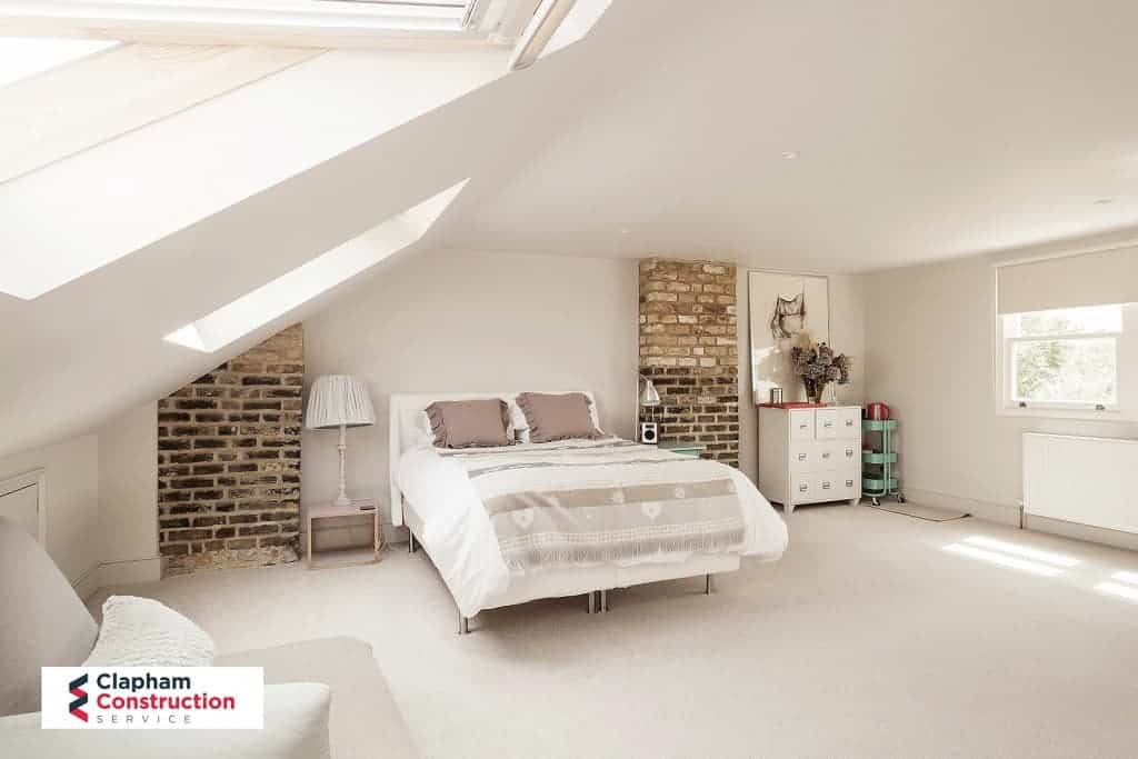 finished master bedroom loft conversion with two skylights