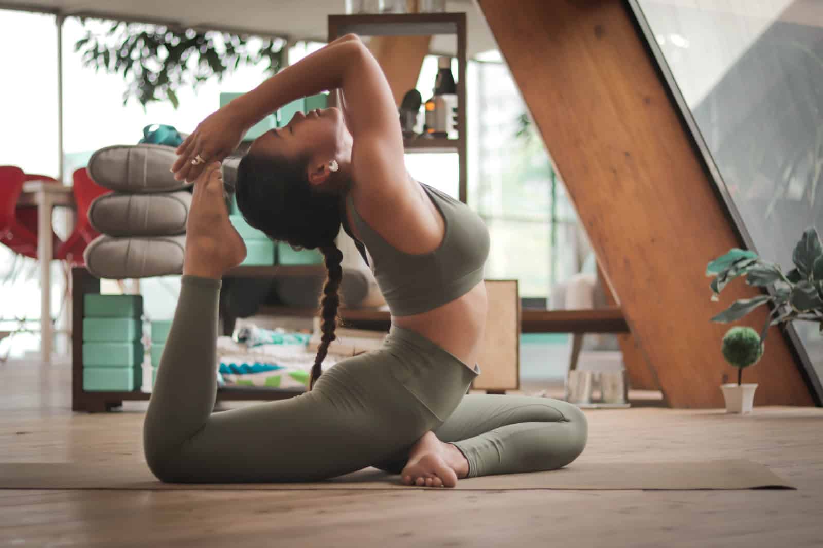 woman doing yoga in loft gym